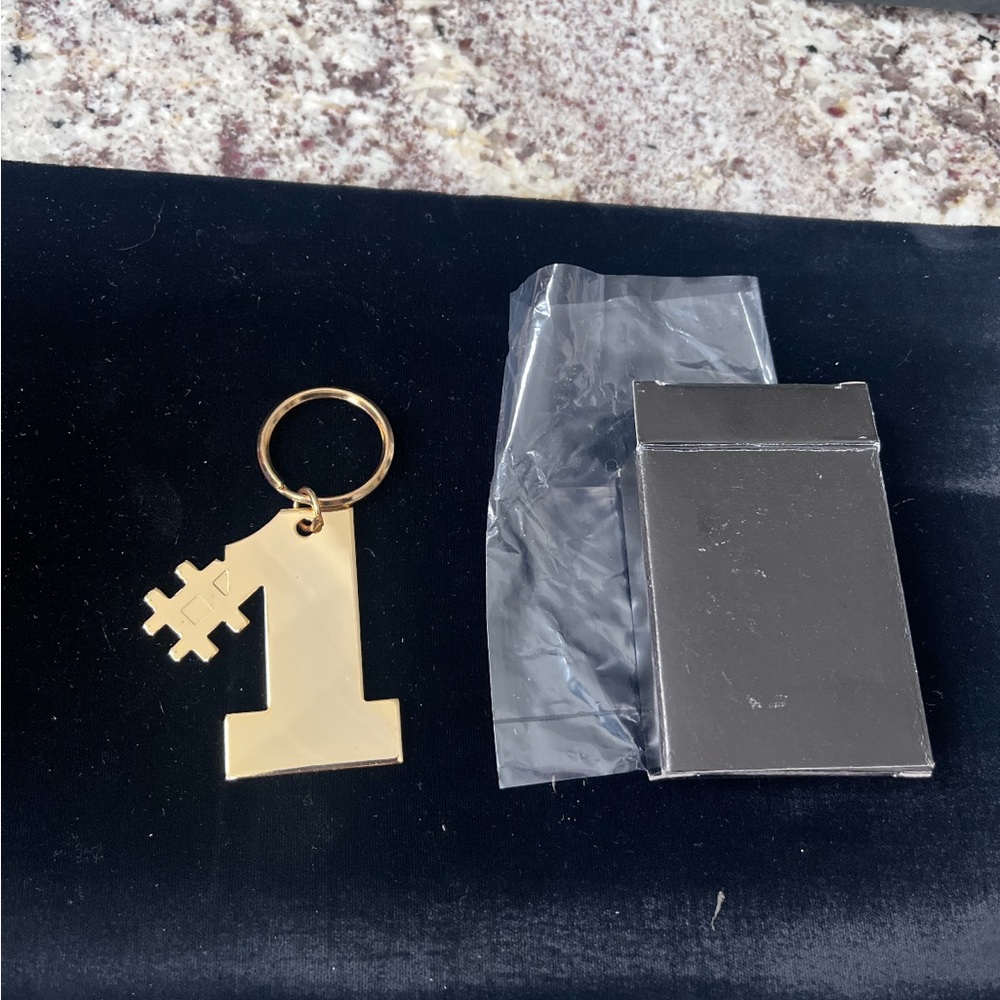 Brand New Number #1 brass key chain.